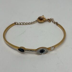 Bracelet with golden water eye with blue and white stone